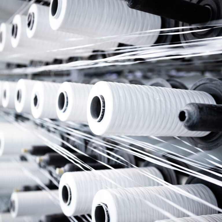 Industrial textile machine with thread spool